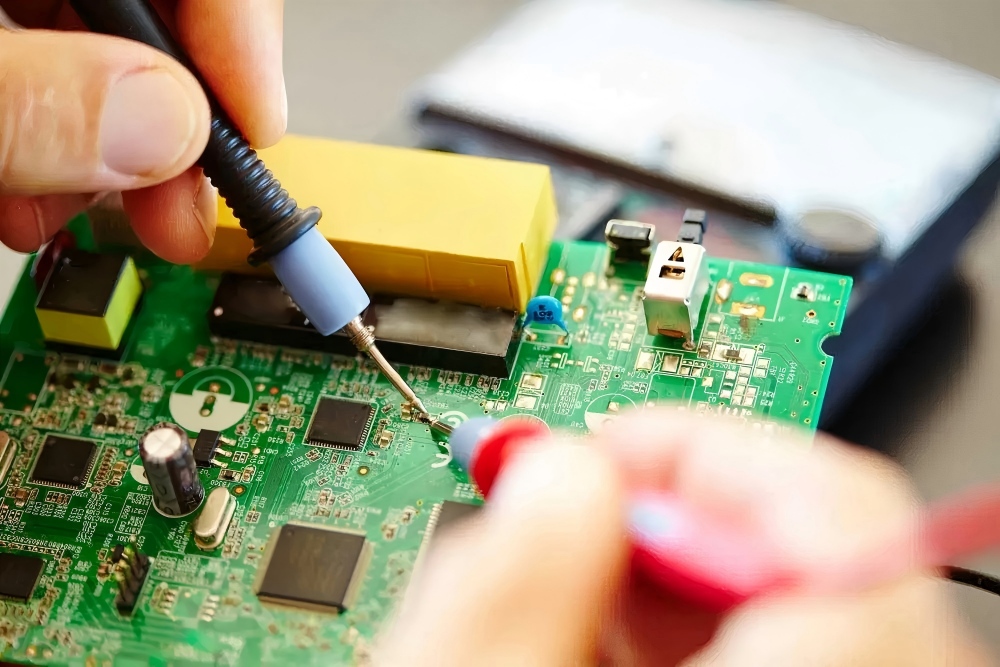 Circuit testing before PCB soldering, using multimeter probes to check solder joint and circuit faults