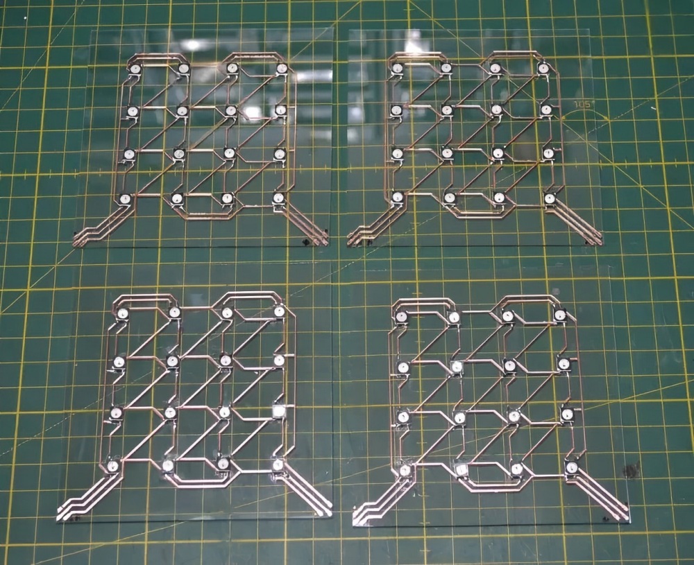 Semi-finished glass-substrate PCB modules with copper traces and positioning holes, featuring a hollow structural design