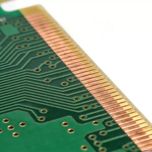 PCB side plating close-up showing copper edge plating from top to bottom on green circuit board