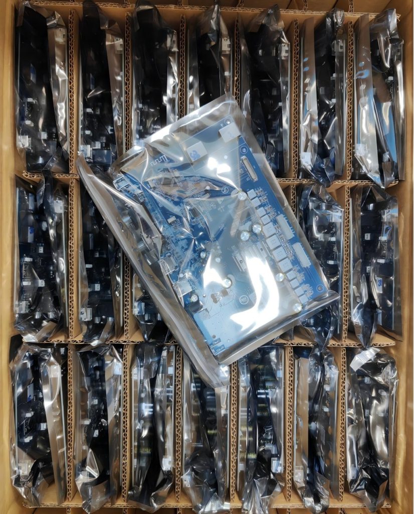 PCB boards in plastic packaging inside a carton