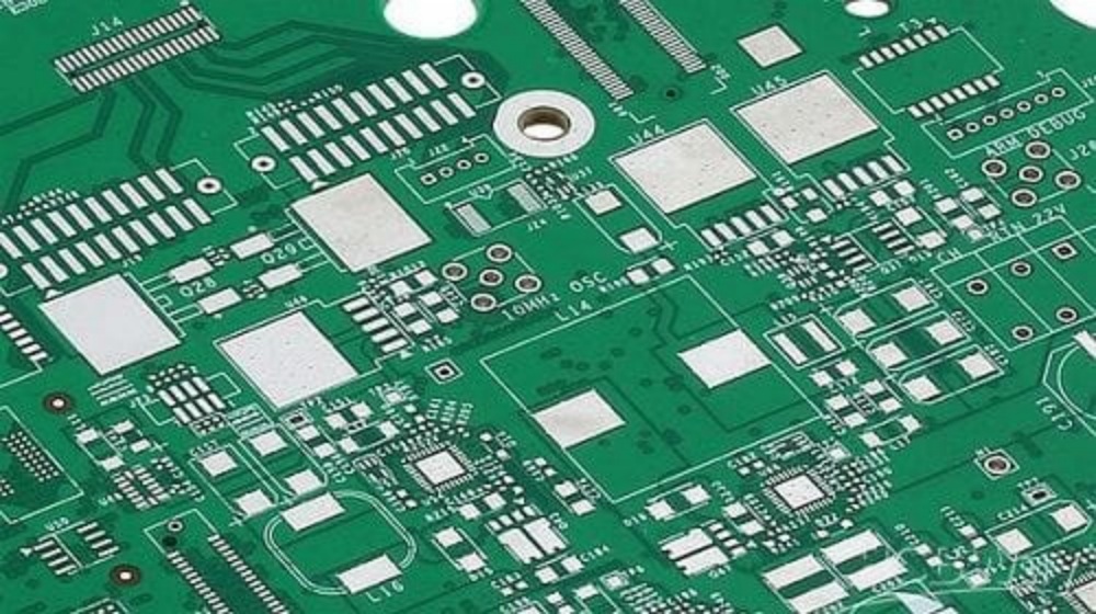Close-up of high-reliability PCB with lead-free HASL (Hot Air Solder Leveling) surface finish, showcasing solder-leveled pads, component footprints, and dense circuit routing for consumer electronics and industrial applications.