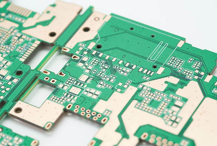 Close-up of multi-panel high-density PCB with exposed copper pads, showing circuit traces and component footprints for electronic manufacturing.