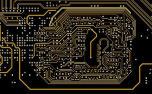 High-density PCB routing near BGA chip, fine trace wiring on printed circuit board, finished PCB solder mask view