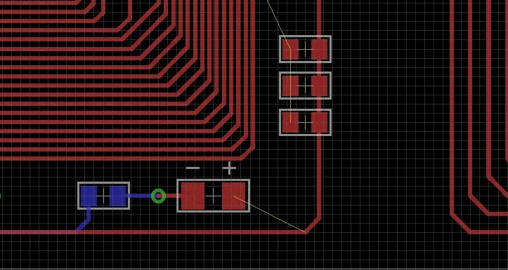 Close-up of PCB routing design in EDA tool, component placement and trace wiring layout