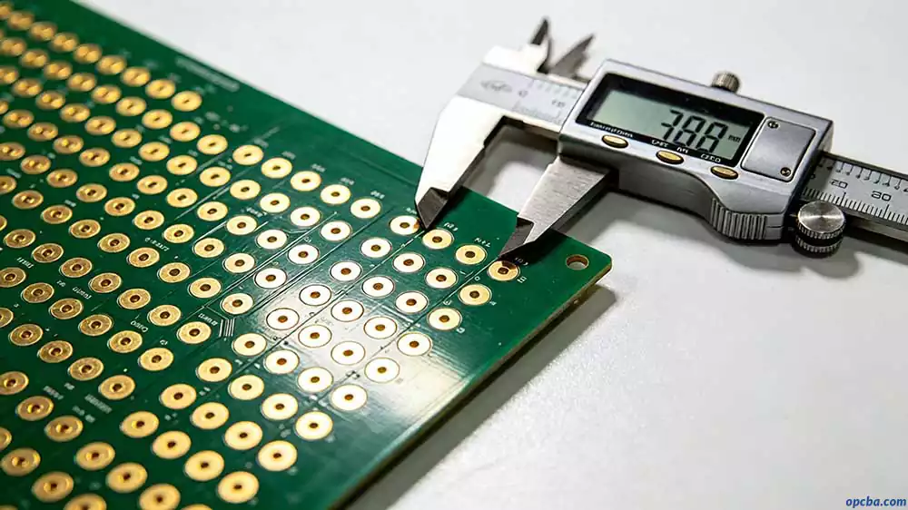 pcb test point design rules demonstrated by precision gold pads and caliper measurement ensuring proper pitch and probe alignment
